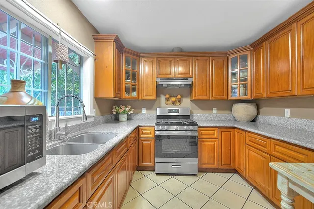 a kitchen with stainless steel appliances a refrigerator and a stove