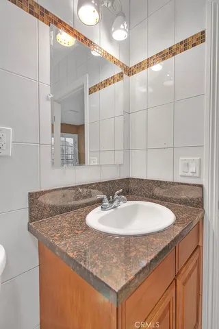 a bedroom with a bed and a lamp