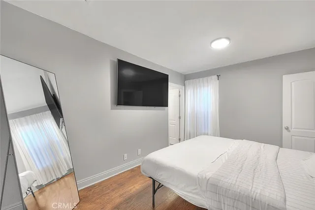 a backyard of a house with plants and trees