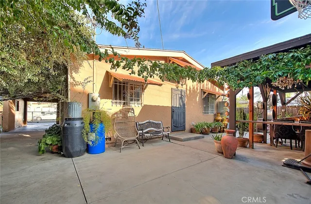 an aerial view of a house with a yard basket ball court and outdoor seating