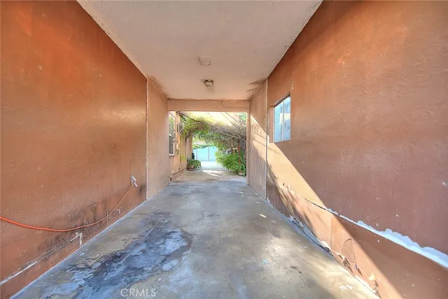 an aerial view of a house with garden space and street view