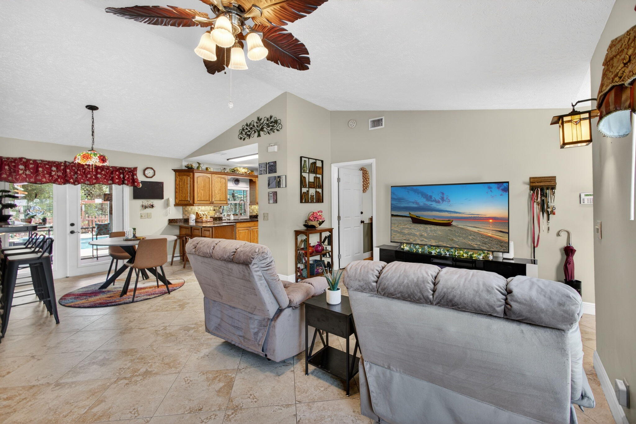 12558 165th Road North Jupiter, FL 33478 - Photo 18 of 67 a living room with furniture and a flat screen tv
