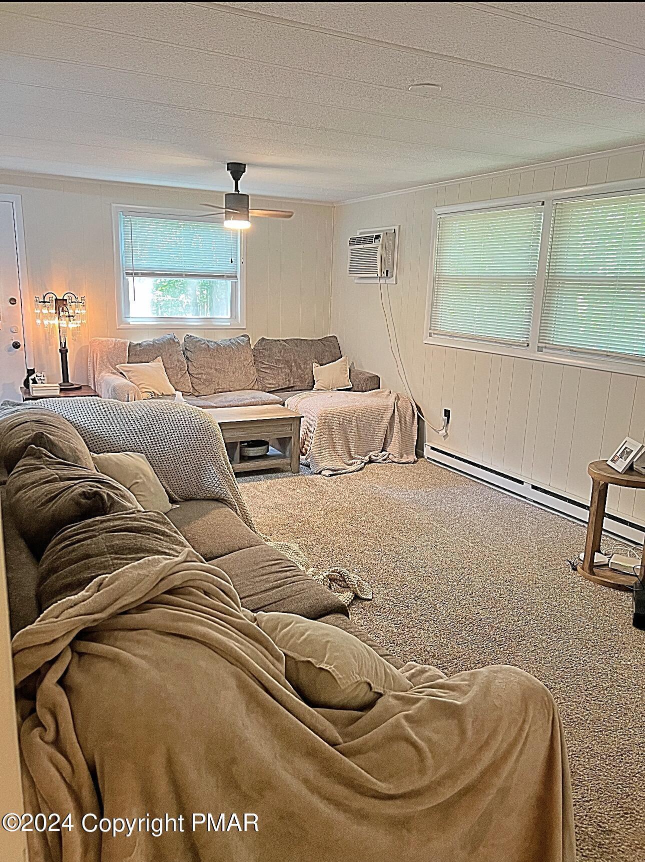 93 Iroquois Road Albrightsville, PA 18210 - Photo 14 of 24 a living room with furniture and a large window