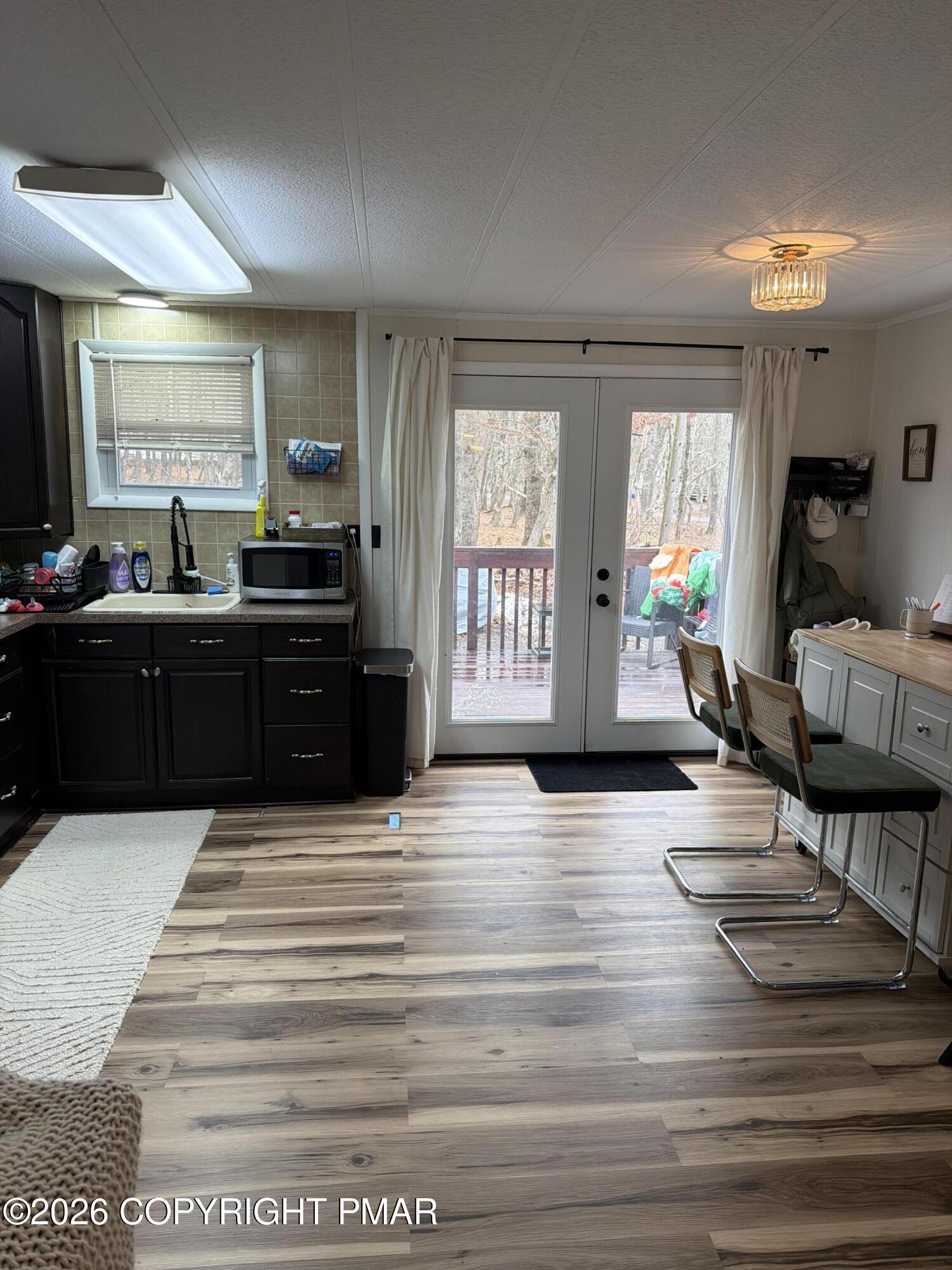 93 Iroquois Road Albrightsville, PA 18210 - Photo 23 of 24 a large kitchen with wooden floor and cabinets