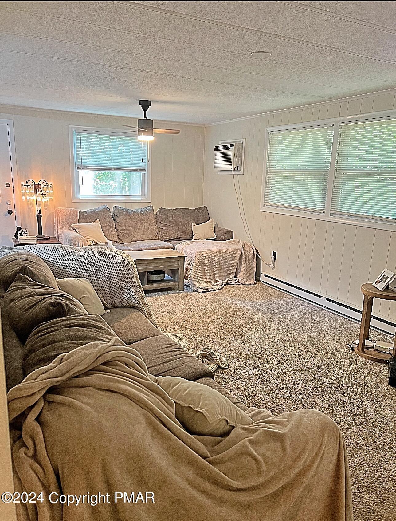 93 Iroquois Road Albrightsville, PA 18210 - Photo 6 of 24 a living room with furniture and a large window