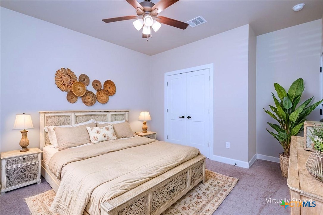 3497 Hooten Bend Kempner, TX 76539 - Photo 12 of 36 a bedroom with a bed and a chandelier