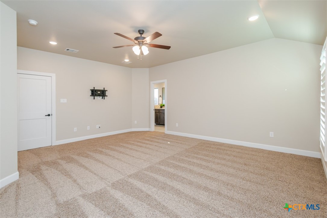 3497 Hooten Bend Kempner, TX 76539 - Photo 27 of 36 a view of an empty room with a chandelier fan