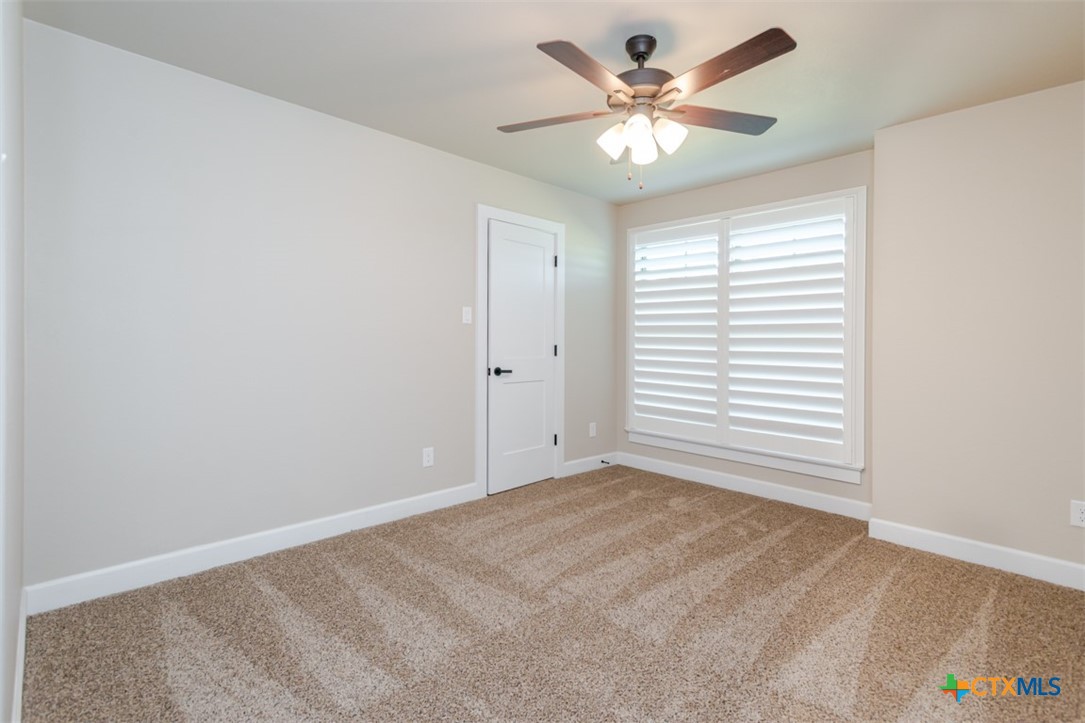 3497 Hooten Bend Kempner, TX 76539 - Photo 30 of 36 a view of a room with a window and a ceiling fan