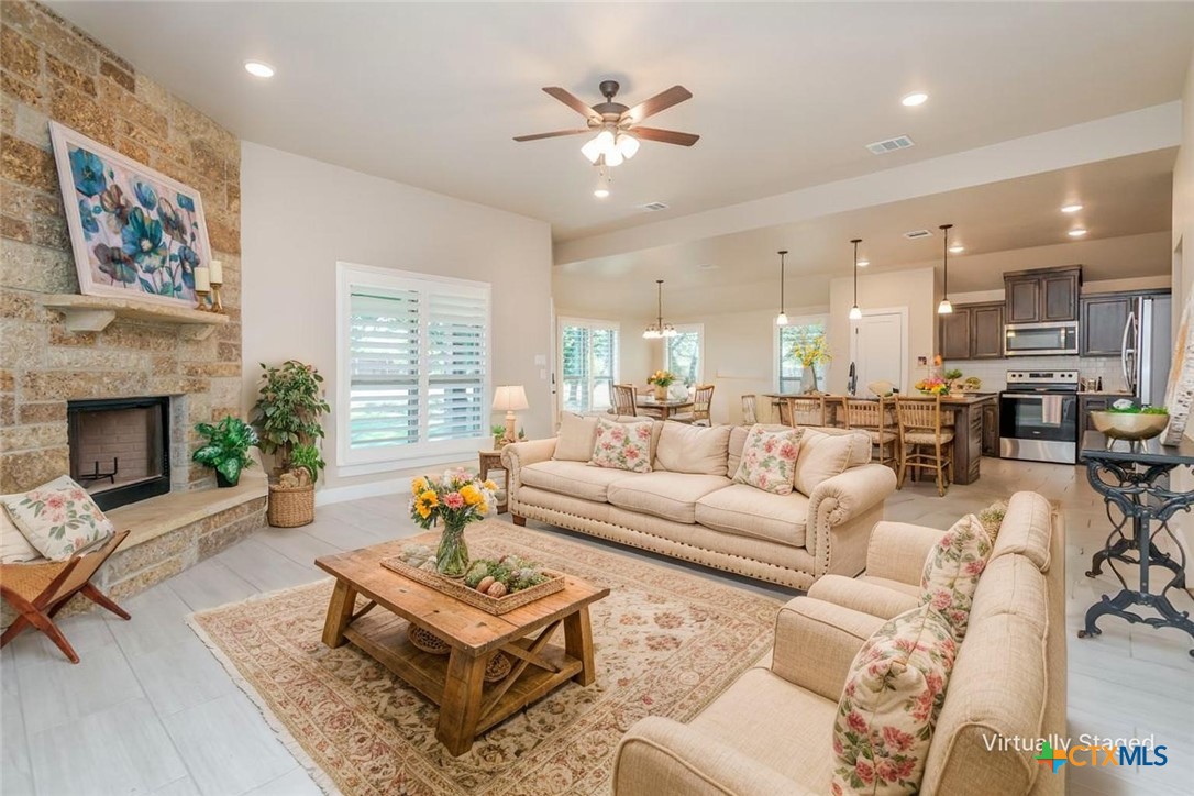 3497 Hooten Bend Kempner, TX 76539 - Photo 4 of 36 a living room with furniture kitchen view and a fireplace