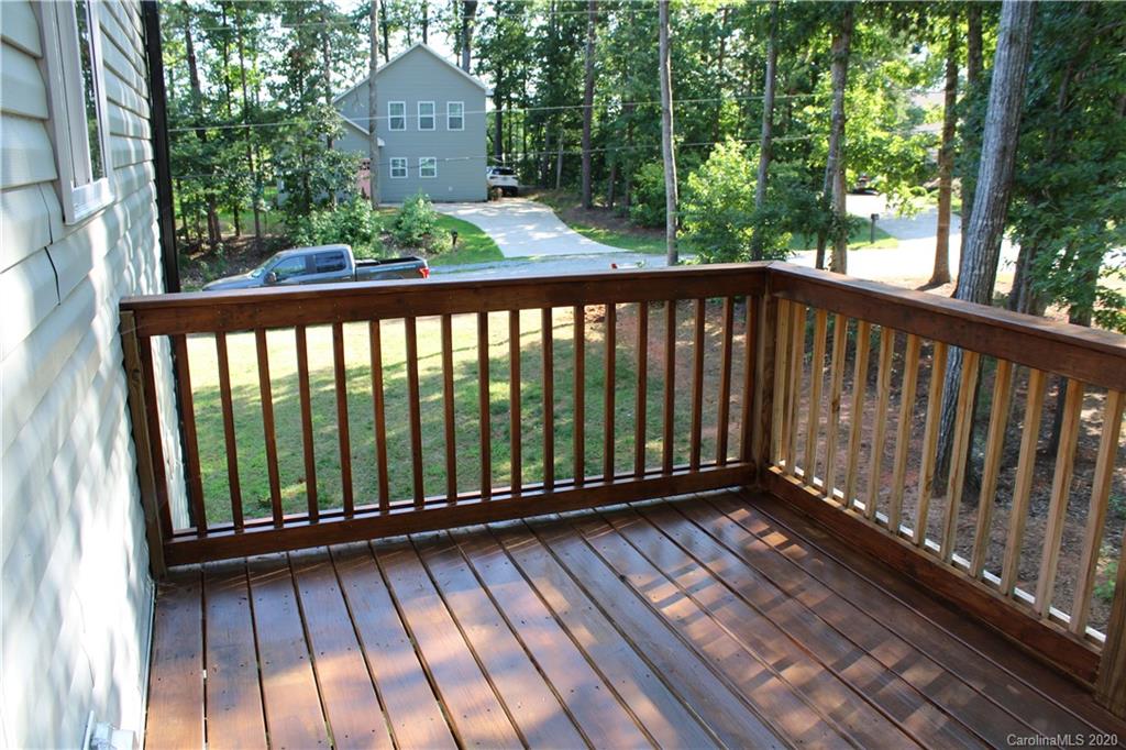 7716 Red Robin Trail Denver, NC 28037 - Photo 11 of 29 a view of balcony with wooden floor and fence