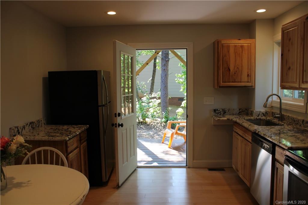 7716 Red Robin Trail Denver, NC 28037 - Photo 13 of 29 a kitchen with a refrigerator a sink and a stove
