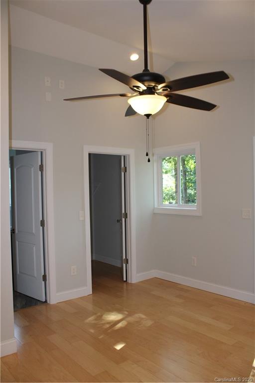 7716 Red Robin Trail Denver, NC 28037 - Photo 14 of 29 a view of a chandelier fan and a ceiling fan