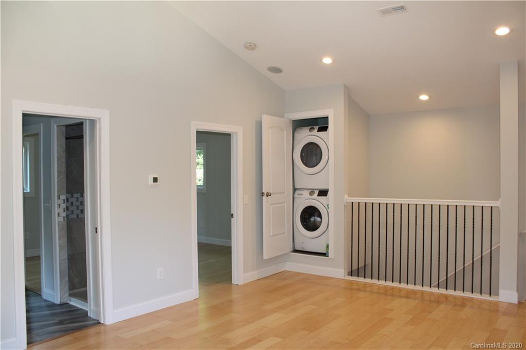 7716 Red Robin Trail Denver, NC 28037 - Photo 3 of 29 a view of a hallway with a washer and dryer