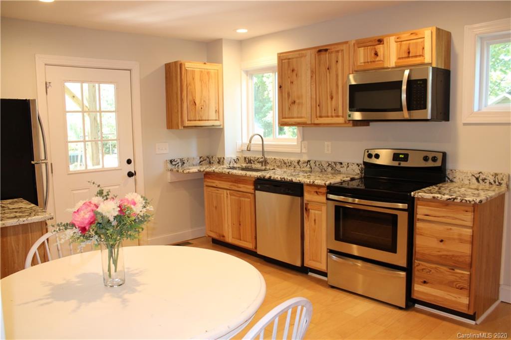7716 Red Robin Trail Denver, NC 28037 - Photo 22 of 29 a kitchen with a sink stove and microwave