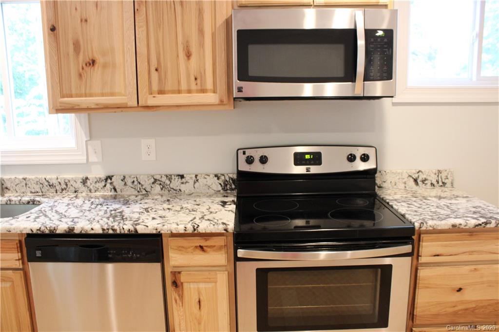 7716 Red Robin Trail Denver, NC 28037 - Photo 26 of 29 a stove top oven sitting inside of a kitchen