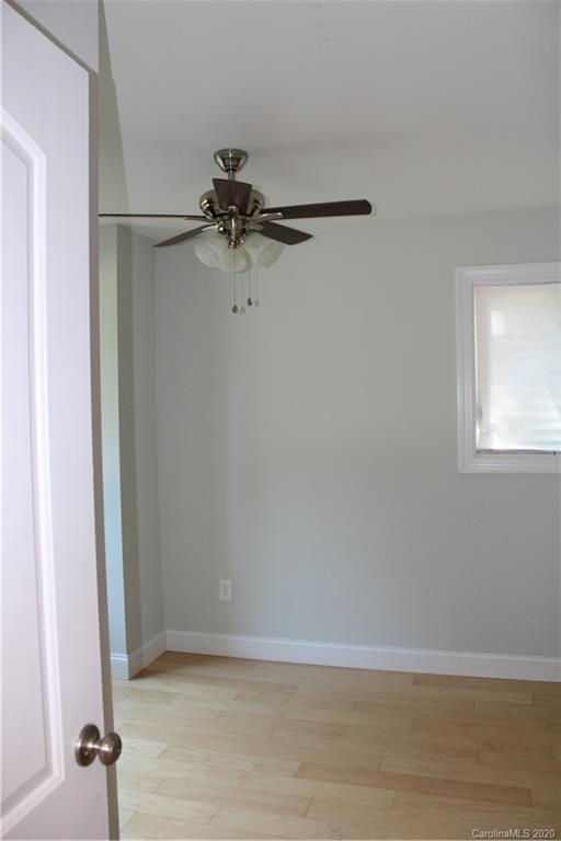 7716 Red Robin Trail Denver, NC 28037 - Photo 29 of 29 a view of a small space with wooden floor and a window
