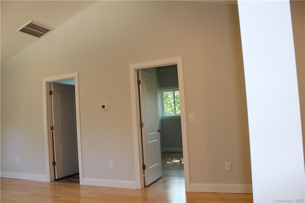7716 Red Robin Trail Denver, NC 28037 - Photo 8 of 29 a view of a hallway with wooden floor