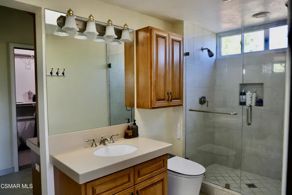 a bathroom with a tub and shower