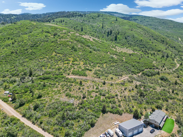 2459 Painter Road Marion, UT 84036 - Photo 36 of 42 Expansive mountainous property featuring a contemporary residence, detached garage structure, and verdant natural landscaping