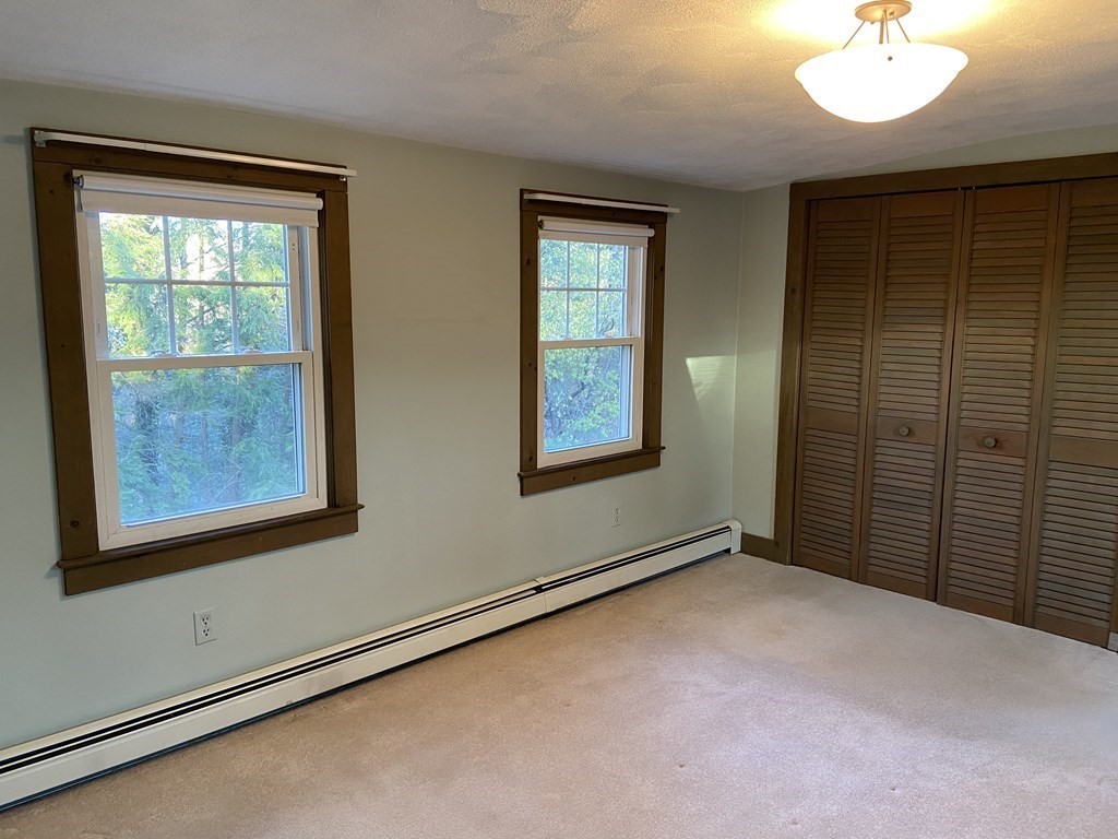 751 Central Avenue Needham, MA 02494 - Photo 15 of 21 a view of an empty room with a window