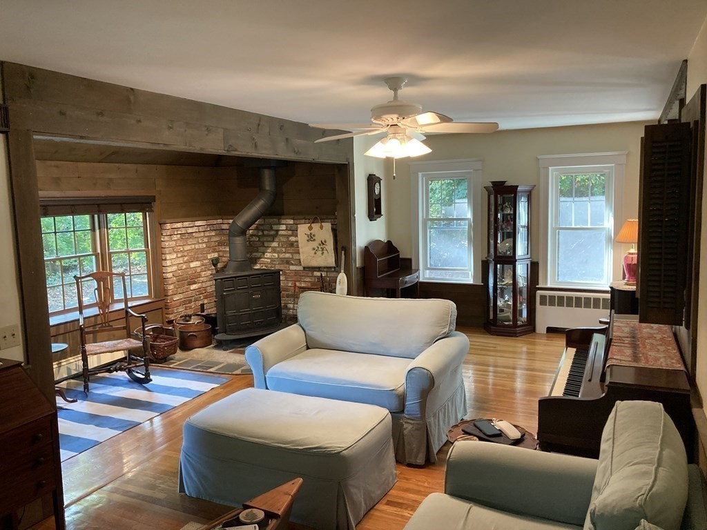 751 Central Avenue Needham, MA 02494 - Photo 7 of 21 a living room with furniture a large window and a chandelier