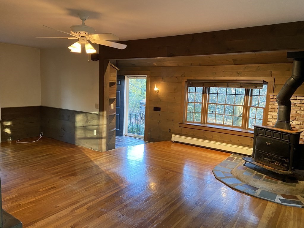 751 Central Avenue Needham, MA 02494 - Photo 9 of 21 a view of an empty room with wooden floor and a window