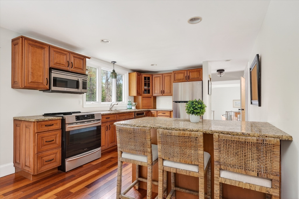 59 First Parish Road Norwell, MA 02061 - Photo 10 of 37 a kitchen with stainless steel appliances granite countertop a stove top oven a sink and dishwasher