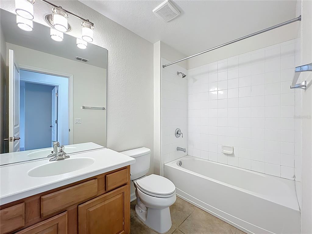 12930 Vennetta Way Windermere, FL 34786 - Photo 26 of 38 a bathroom with a sink a toilet and shower
