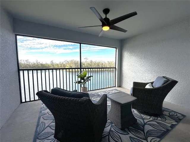 a balcony view with a seating space