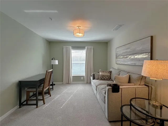 a bedroom with furniture and a window