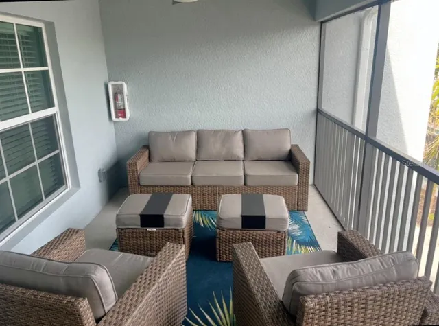 a living room with furniture and a window