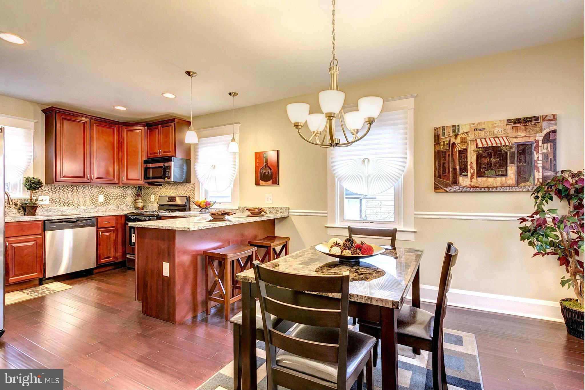 5800 Clearspring Road Baltimore, MD 21212 - Photo 1 of 30 a view of a dining room with furniture wooden floor and chandelier