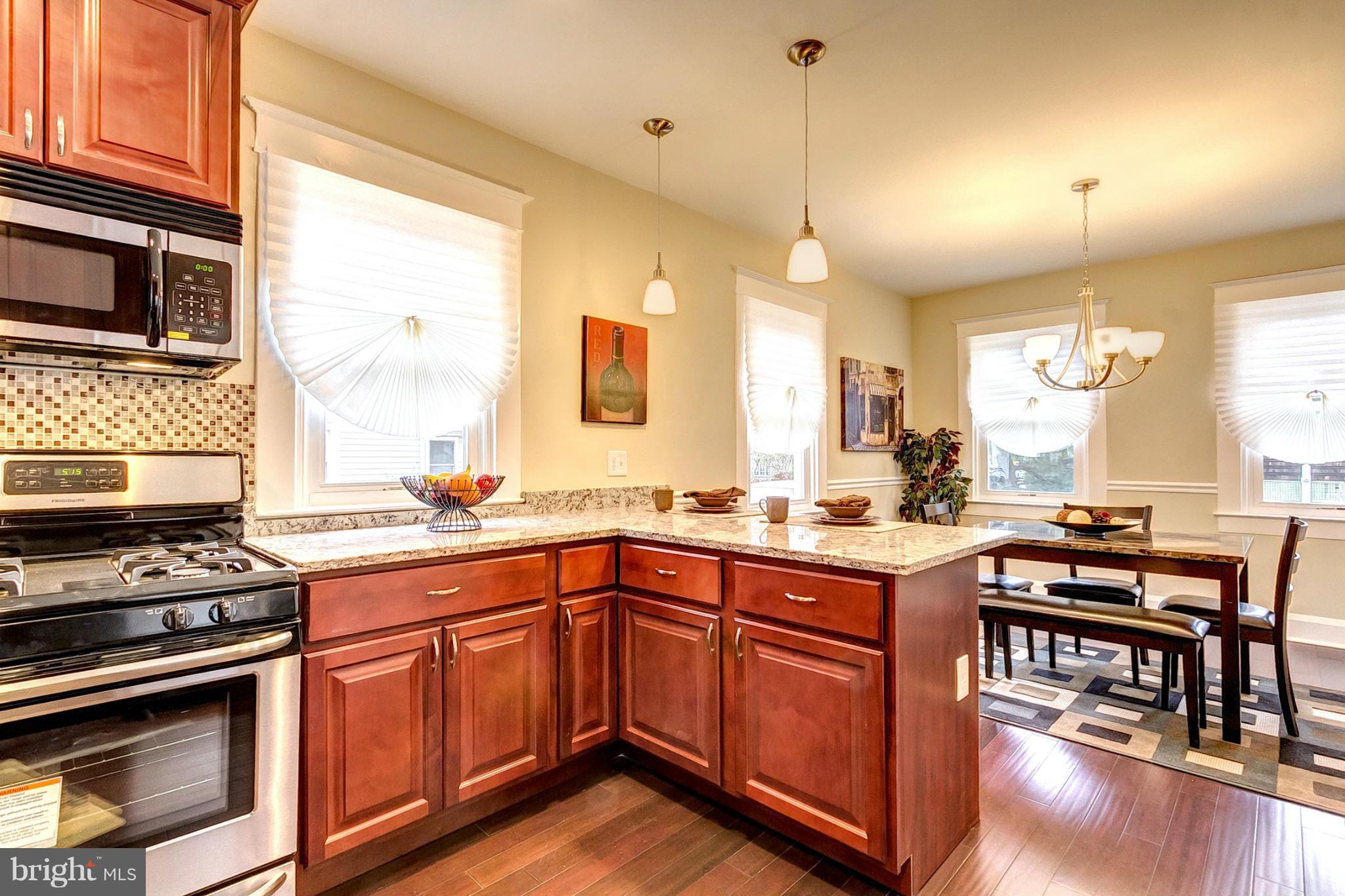 5800 Clearspring Road Baltimore, MD 21212 - Photo 11 of 30 a kitchen with a sink stove and microwave