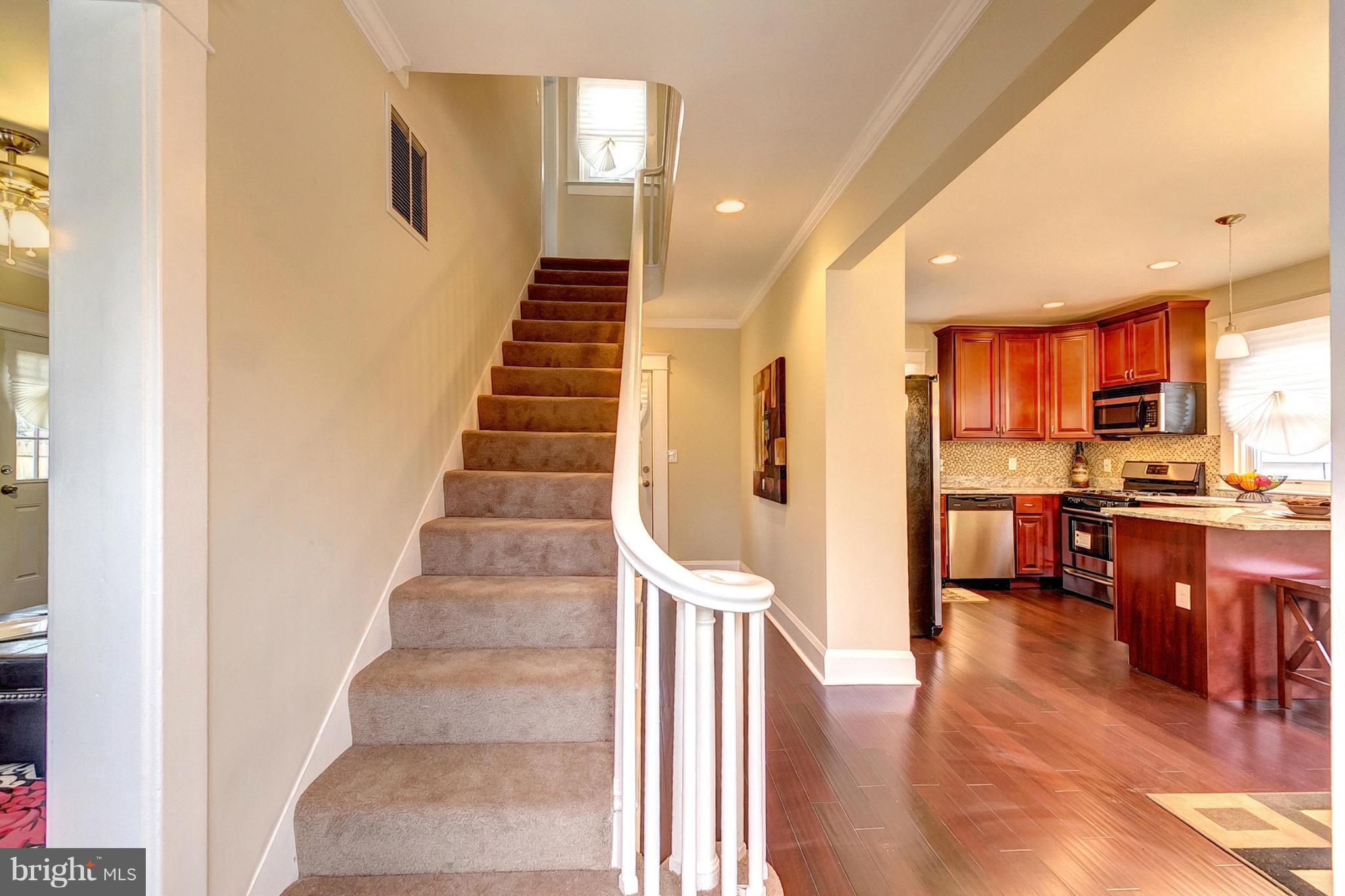 5800 Clearspring Road Baltimore, MD 21212 - Photo 17 of 30 a view of a kitchen with furniture and wooden floor