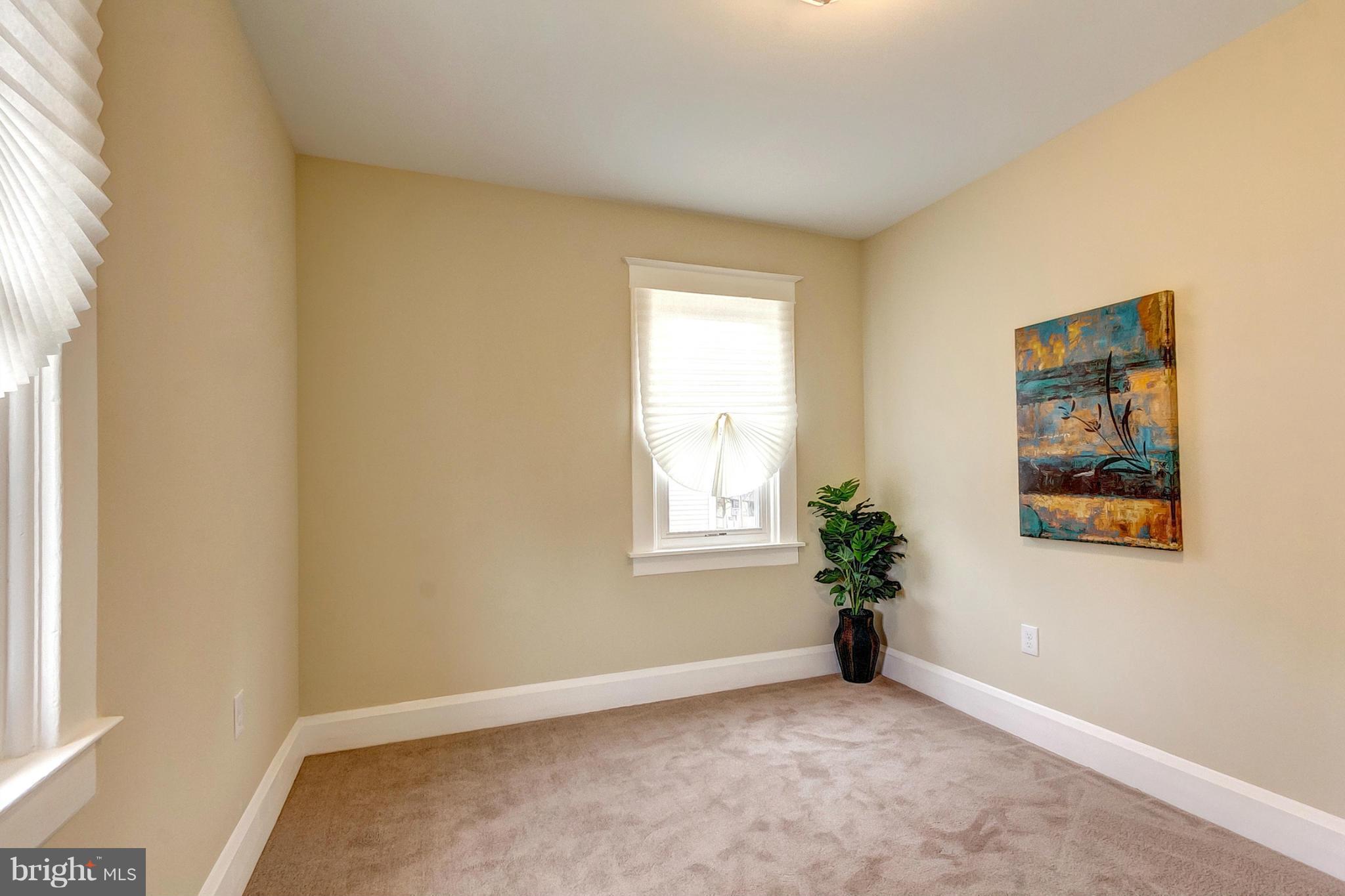 5800 Clearspring Road Baltimore, MD 21212 - Photo 24 of 30 an empty room with windows and flower pot