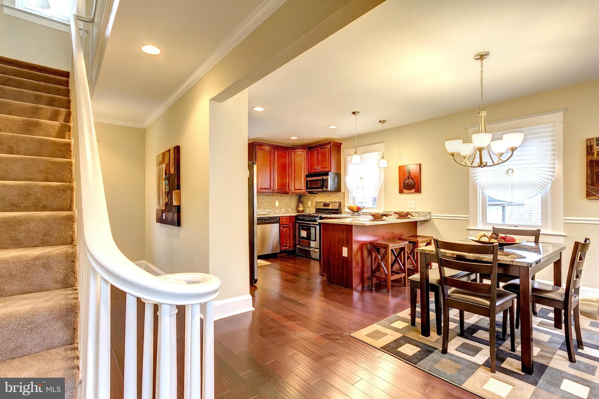 5800 Clearspring Road Baltimore, MD 21212 - Photo 3 of 30 a view of a dining room with furniture window and wooden floor
