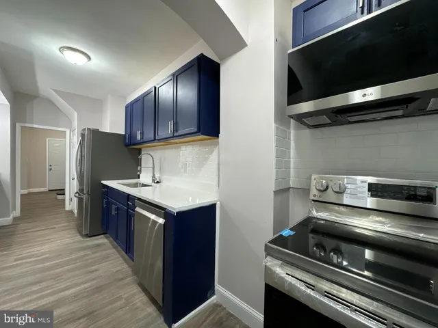 a kitchen with a stove and a microwave