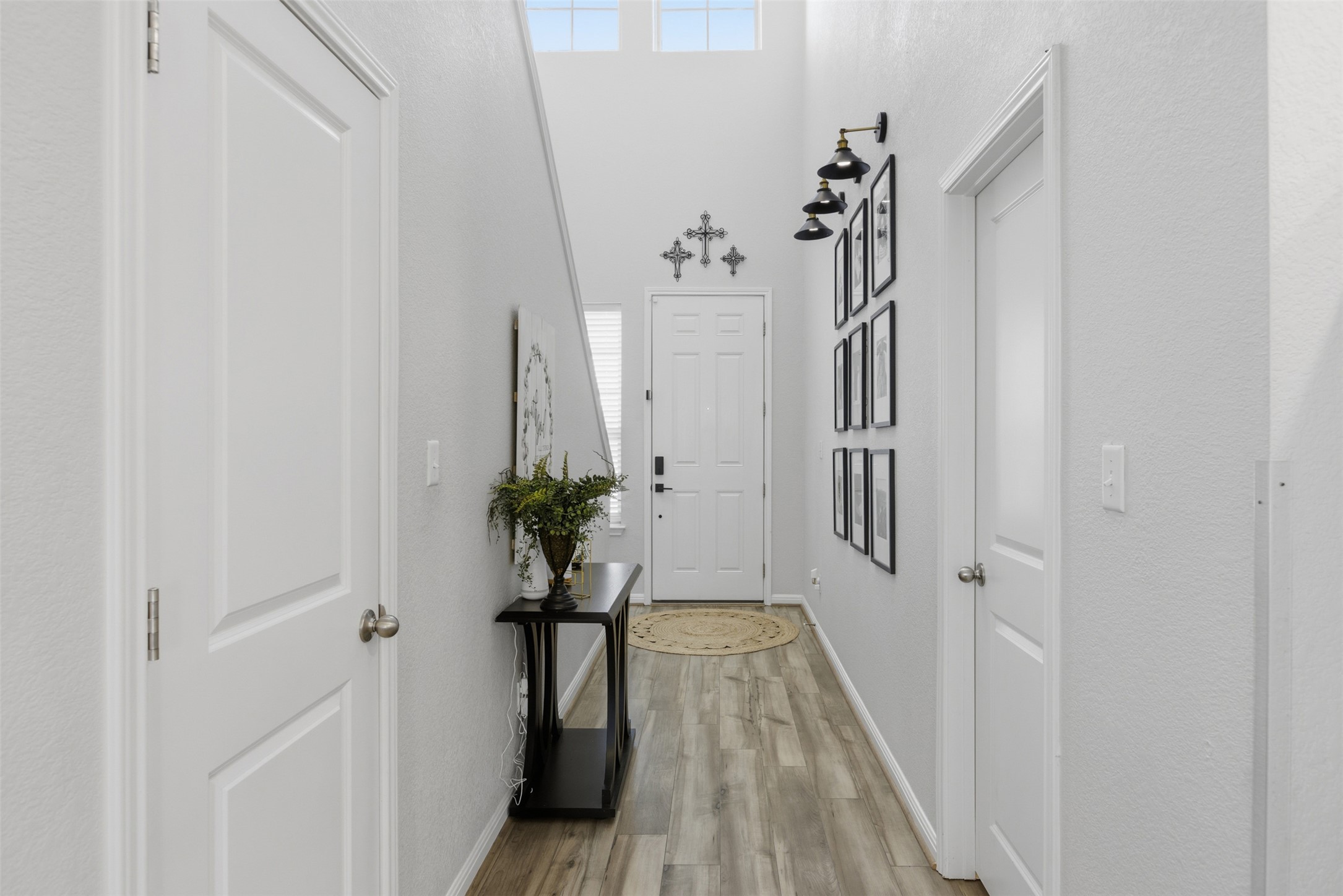 431 Dipprey Lane Georgetown, TX 78628 - Photo 11 of 39 a view of a hallway with wooden floor and staircase