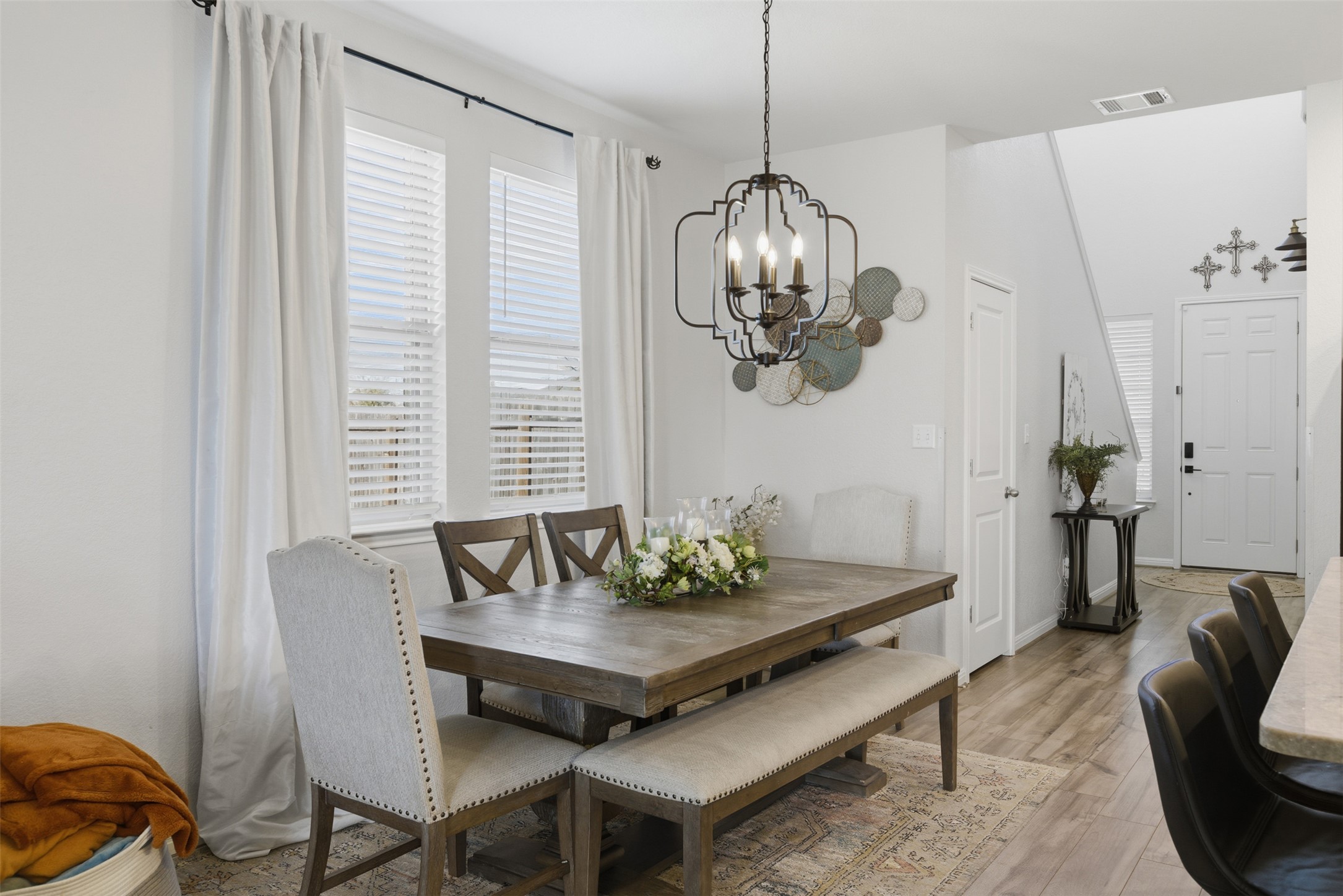 431 Dipprey Lane Georgetown, TX 78628 - Photo 13 of 39 a view of a dining room with furniture wooden floor and chandelier