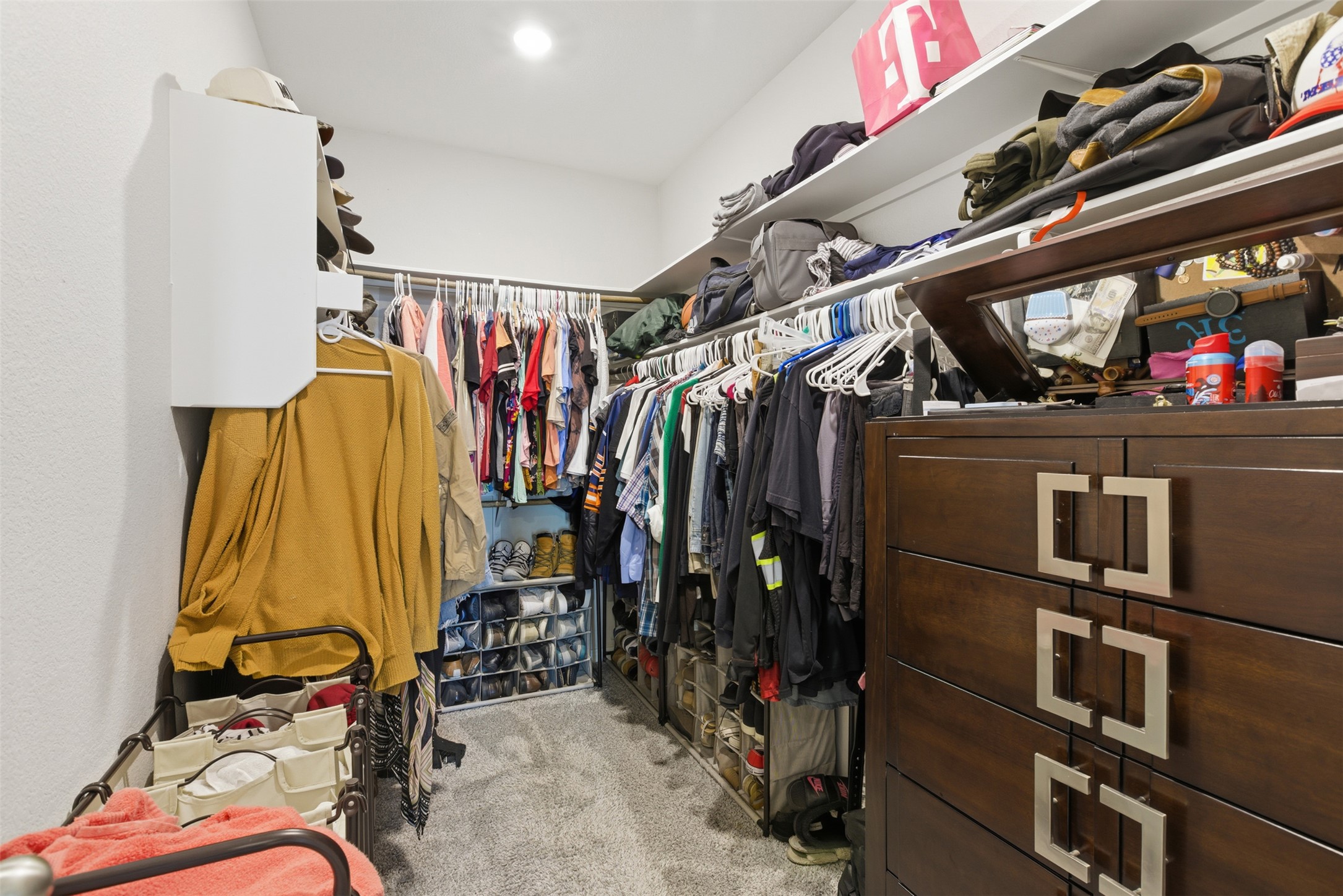 431 Dipprey Lane Georgetown, TX 78628 - Photo 24 of 39 a view of walk in closet with clothes