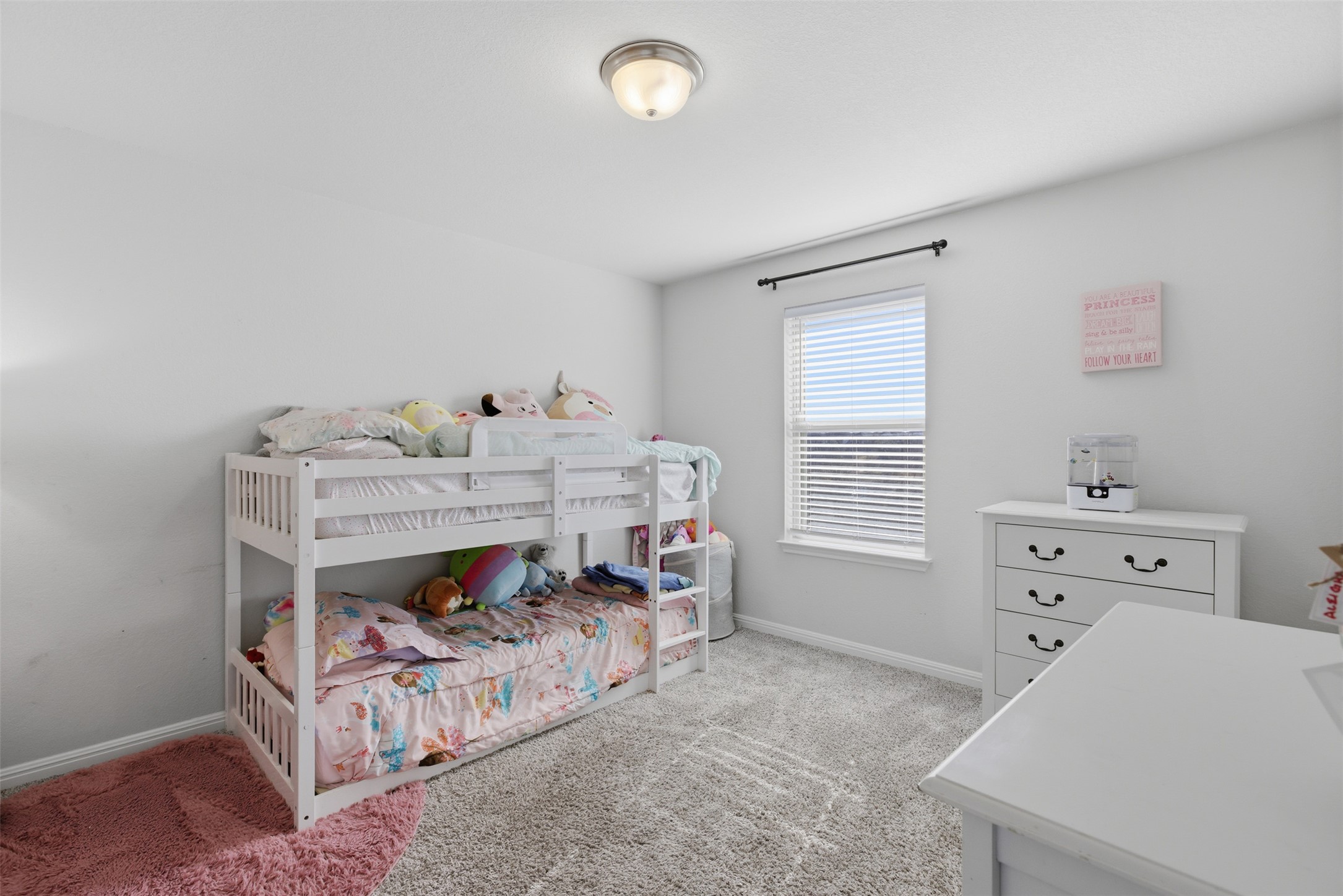 431 Dipprey Lane Georgetown, TX 78628 - Photo 30 of 39 a room with a baby bed baby crib and a dresser