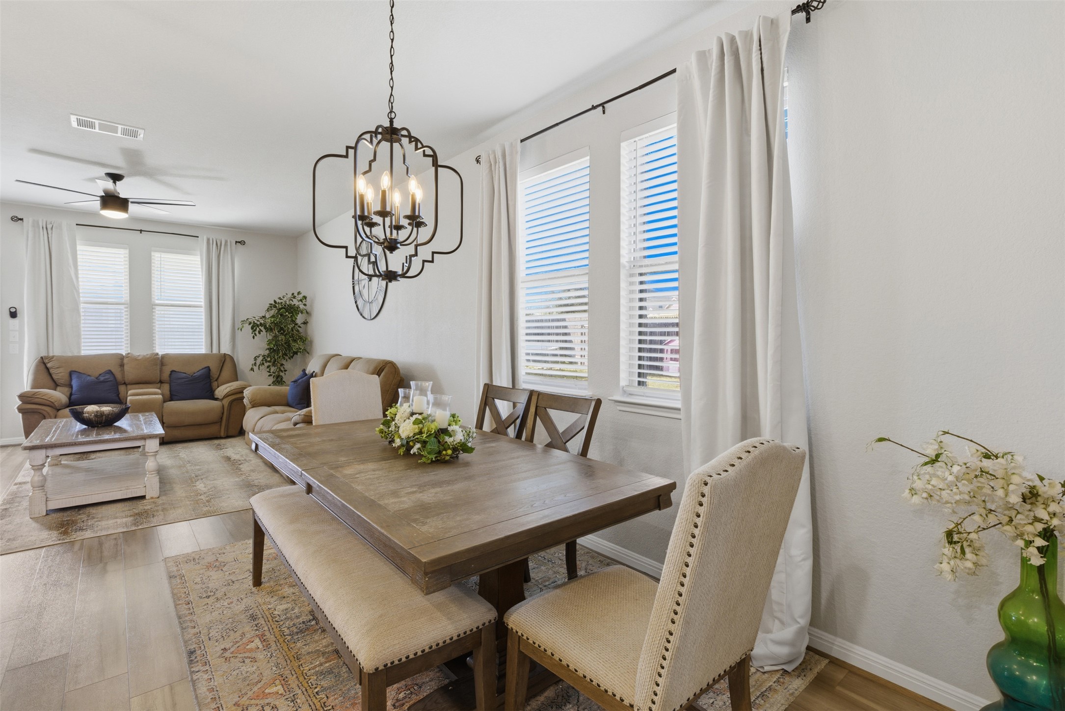 431 Dipprey Lane Georgetown, TX 78628 - Photo 6 of 39 a view of a dining room with furniture wooden floor and chandelier
