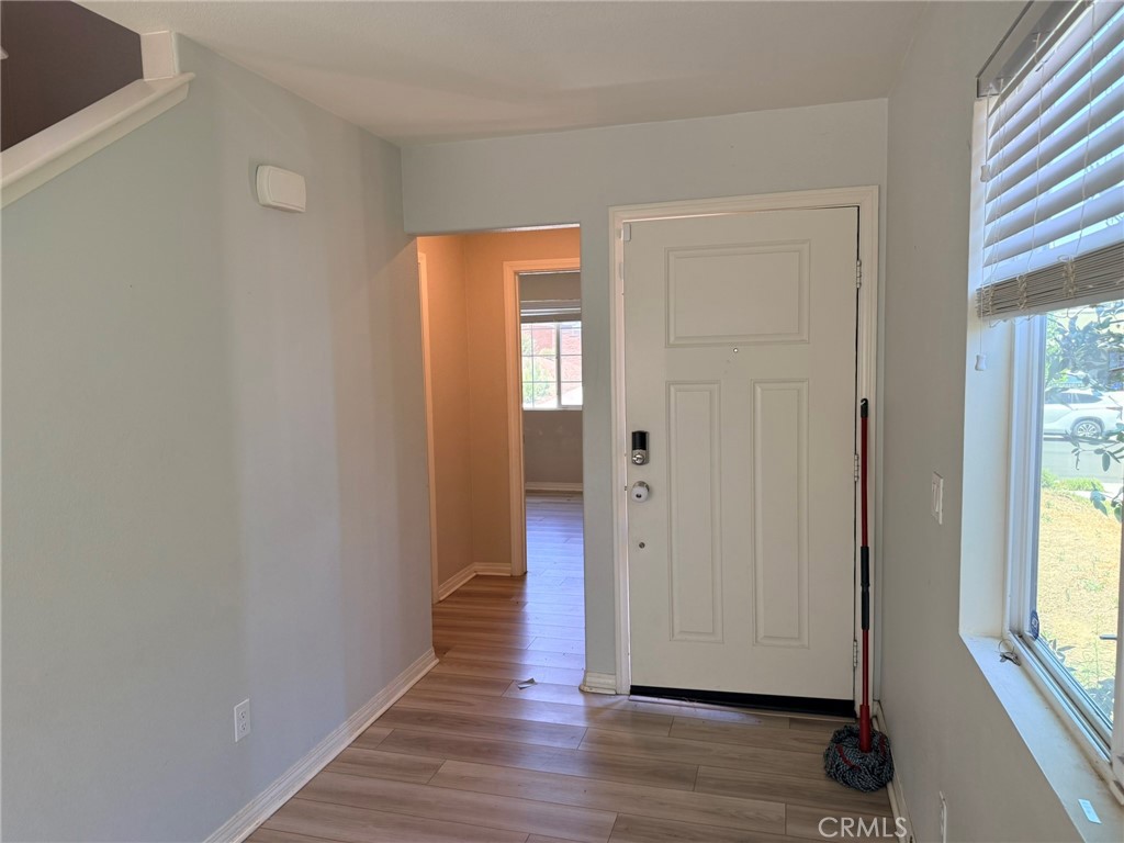 32201 Rambling Court Winchester, CA 92596 - Photo 10 of 11 a view of a livingroom with wooden floor and windows