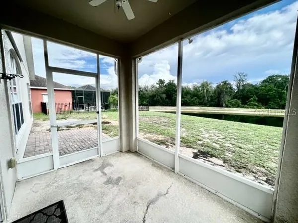 an aerial view of a house with swimming pool and outdoor space