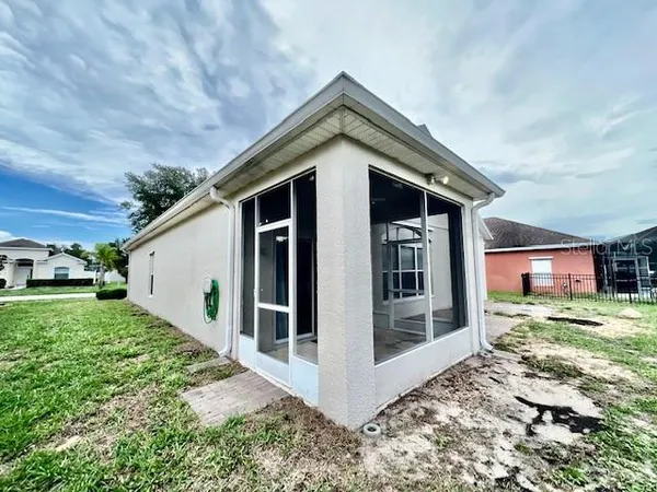 a front view of house with yard and outdoor seating