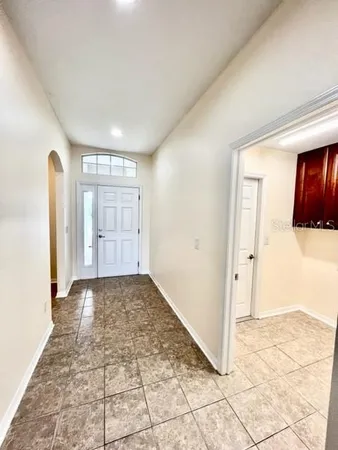 a kitchen with stainless steel appliances granite countertop a refrigerator sink and cabinets