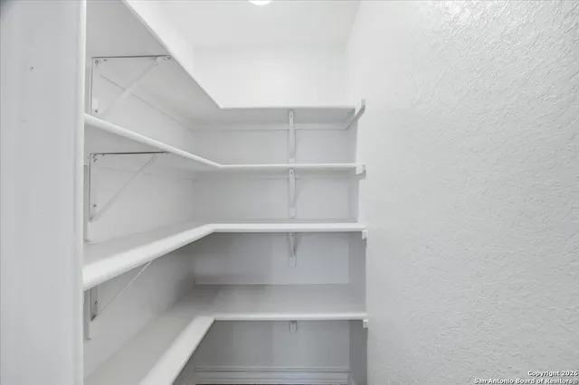 a view of an empty walk in closet