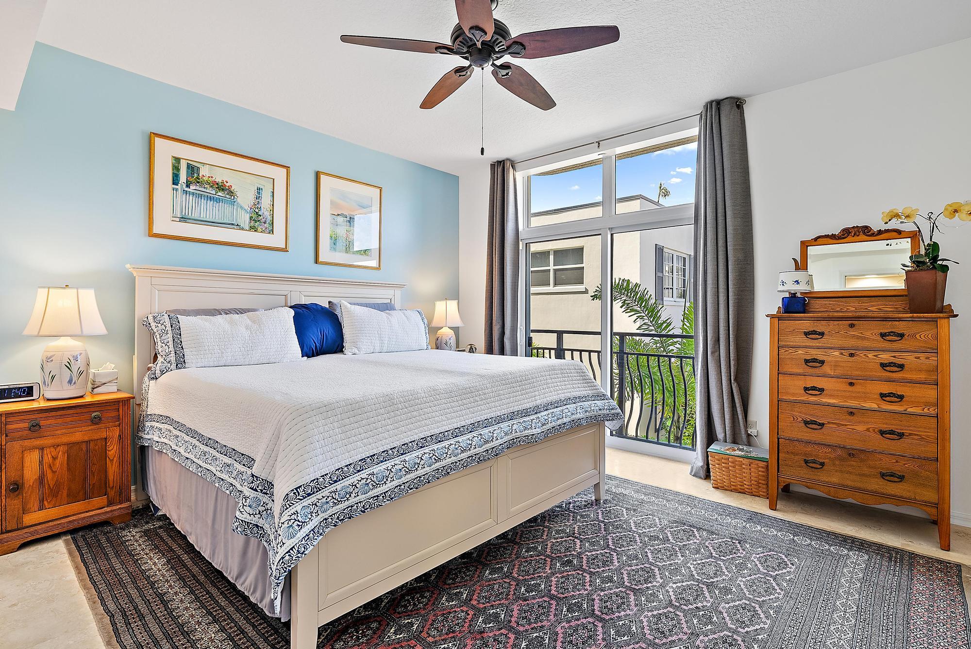 314 Inlet Way, Unit 103 Palm Beach Shores, FL 33404 - Photo 11 of 20 a bedroom with a bed and a window