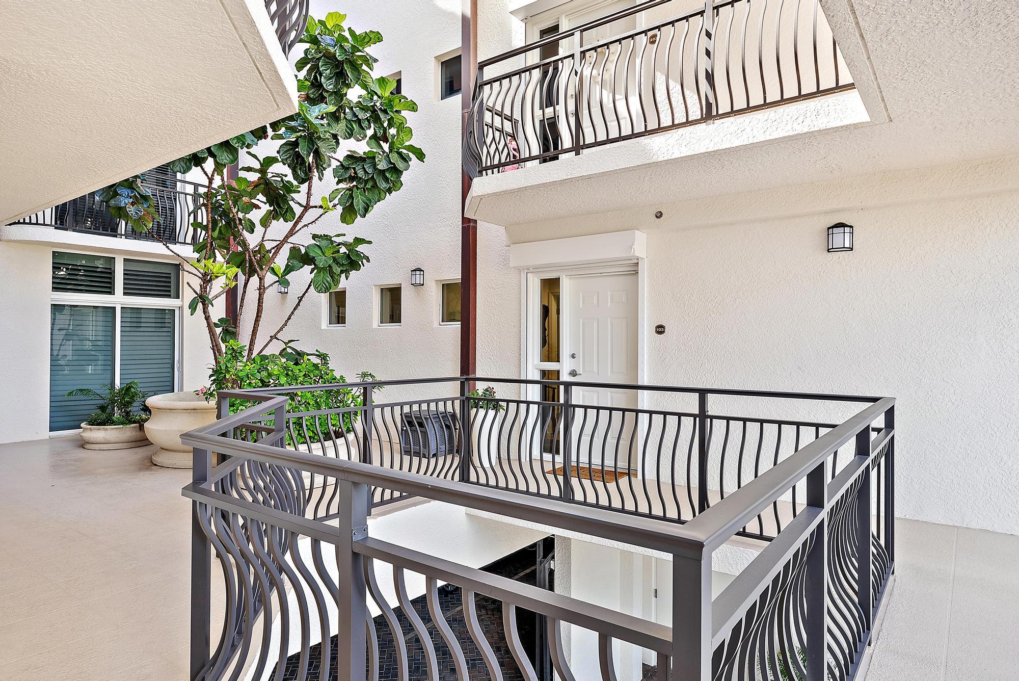 314 Inlet Way, Unit 103 Palm Beach Shores, FL 33404 - Photo 20 of 20 a view of balcony with deck and outdoor seating