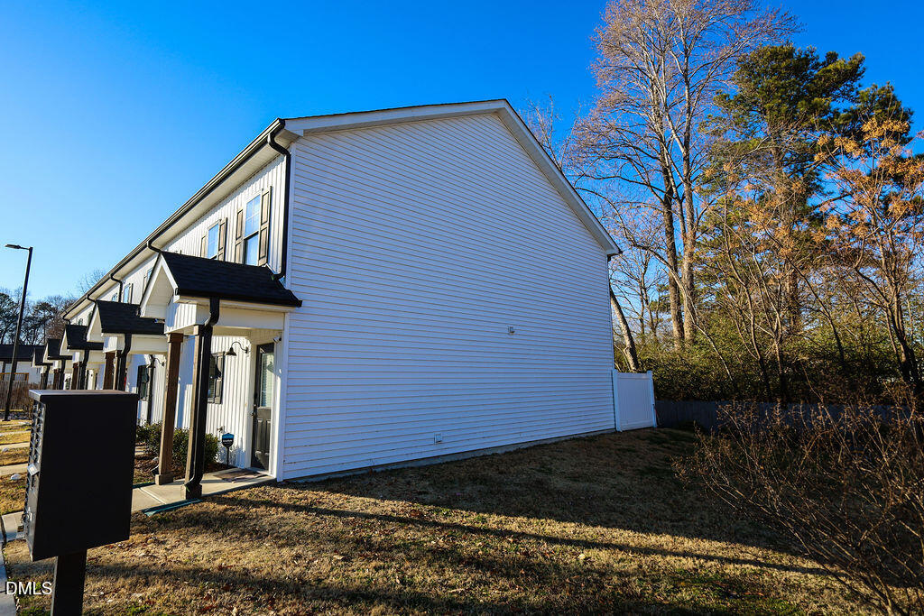 230 South Raleigh Street Angier, NC 27501 - Photo 3 of 38 a view of a house with a yard